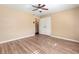 Bedroom featuring wood floors, tan walls, and a double-door closet at 508 Greenridge Cir, Stone Mountain, GA 30083