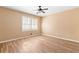 Bedroom featuring wood floors, tan walls, and a window at 508 Greenridge Cir, Stone Mountain, GA 30083