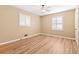 Bedroom featuring wood floors, tan walls, and two windows at 508 Greenridge Cir, Stone Mountain, GA 30083