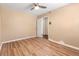 Bedroom featuring wood floors, tan walls, and a ceiling fan at 508 Greenridge Cir, Stone Mountain, GA 30083