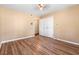 Bedroom featuring wood floors, tan walls, and a double-door closet at 508 Greenridge Cir, Stone Mountain, GA 30083
