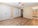 Bedroom featuring wood floors, tan walls, and a bathroom at 508 Greenridge Cir, Stone Mountain, GA 30083