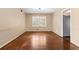 Empty dining room with hardwood floors, a window, and neutral paint at 508 Greenridge Cir, Stone Mountain, GA 30083