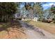 View of the long driveway leading up to the house with mature trees at 508 Greenridge Cir, Stone Mountain, GA 30083
