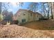 Rear exterior of a brick home featuring a deck and walkout basement access at 508 Greenridge Cir, Stone Mountain, GA 30083