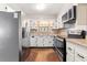The kitchen has stainless steel appliances and white cabinets at 508 Greenridge Cir, Stone Mountain, GA 30083