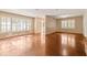 The room has hardwood floors, large windows, and neutral paint at 508 Greenridge Cir, Stone Mountain, GA 30083