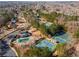 Aerial view of the community featuring a pool, clubhouse, and tennis courts at 612 Vinings Estates Se Dr # B12, Smyrna, GA 30126