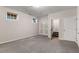 Finished carpeted basement with closet, doors, and small windows at 612 Vinings Estates Se Dr # B12, Smyrna, GA 30126