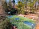 Aerial view of a basketball court nestled amongst trees, perfect for outdoor recreation and fitness at 612 Vinings Estates Se Dr # B12, Smyrna, GA 30126