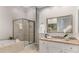 Luxurious bathroom with a glass-enclosed shower, soaking tub, and granite countertops, designed for ultimate relaxation at 612 Vinings Estates Se Dr # B12, Smyrna, GA 30126
