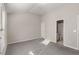 A bedroom with light-colored walls and carpet, as well as an attached bathroom with a walk-in shower at 612 Vinings Estates Se Dr # B12, Smyrna, GA 30126