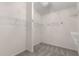 Walk-in closet featuring carpeted floors and shelves for storage in an organized space at 612 Vinings Estates Se Dr # B12, Smyrna, GA 30126