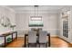 Elegant dining room featuring hardwood floors, modern lighting, and stylish decor at 612 Vinings Estates Se Dr # B12, Smyrna, GA 30126
