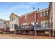 Townhome exterior with a deck on the second floor and a patio on the ground floor at 612 Vinings Estates Se Dr # B12, Smyrna, GA 30126