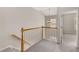 Upstairs hallway with a view of a staircase and chandelier and an open door to another room at 612 Vinings Estates Se Dr # B12, Smyrna, GA 30126