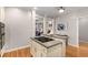 Open kitchen design with a cooking island and view into adjacent living space at 612 Vinings Estates Se Dr # B12, Smyrna, GA 30126