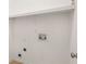 Minimalist laundry room with bright white walls and all the necessary hookups for a washer and dryer at 612 Vinings Estates Se Dr # B12, Smyrna, GA 30126
