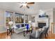 Bright living room features a fireplace, built-in shelving, and large windows at 612 Vinings Estates Se Dr # B12, Smyrna, GA 30126