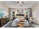 Serene main bedroom featuring a decorative rug, two windows, and sophisticated decor, offering a relaxing retreat at 612 Vinings Estates Se Dr # B12, Smyrna, GA 30126