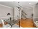 Inviting office area showcasing hardwood floors, stylish lighting, and a staircase leading to another level at 612 Vinings Estates Se Dr # B12, Smyrna, GA 30126