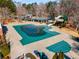 Aerial view of a community pool with slides, tennis courts, and a covered picnic area for residents at 612 Vinings Estates Se Dr # B12, Smyrna, GA 30126