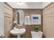 Chic powder room with elegant fixtures, decorative wallpaper, and wainscoting, creating a refined space at 612 Vinings Estates Se Dr # B12, Smyrna, GA 30126