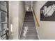 Carpeted stairway leads to the upper level, complemented by a wooden handrail at 612 Vinings Estates Se Dr # B12, Smyrna, GA 30126