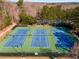 Aerial view of multiple tennis courts offering plenty of space for sports and recreation at 612 Vinings Estates Se Dr # B12, Smyrna, GA 30126