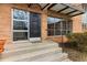 Building entrance with a black door, house number 1235 at 1235 Woodland Ne Ave # 1, Atlanta, GA 30324