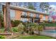Brick apartment building with stairs and balconies overlooking the pool at 1235 Woodland Ne Ave # 1, Atlanta, GA 30324