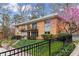 A brick apartment building surrounded by greenery at 1235 Woodland Ne Ave # 1, Atlanta, GA 30324