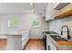 Well equipped kitchen featuring granite counters, modern fixtures, and natural lighting at 1235 Woodland Ne Ave # 1, Atlanta, GA 30324