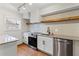 Modern kitchen features stainless steel appliances, granite countertops, and wood flooring at 1235 Woodland Ne Ave # 1, Atlanta, GA 30324