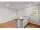 Charming kitchen boasts granite countertop island, modern fixtures, and natural light at 1235 Woodland Ne Ave # 1, Atlanta, GA 30324
