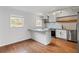 Modern kitchen showcasing stainless steel appliances, stylish backsplash, and breakfast bar at 1235 Woodland Ne Ave # 1, Atlanta, GA 30324
