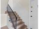 Interior view of a carpeted staircase with a black handrail at 1235 Woodland Ne Ave # 1, Atlanta, GA 30324