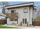 Contemporary two-story home with a balcony, patio, and well-maintained landscaping at 1355 Lockwood Sw Dr, Atlanta, GA 30311