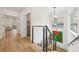 Upstairs hallway featuring an open stairwell, modern chandelier and view of other rooms at 1355 Lockwood Sw Dr, Atlanta, GA 30311