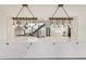 Open-concept kitchen features marble countertops, an eat-in bar, and modern pendant lighting at 1355 Lockwood Sw Dr, Atlanta, GA 30311
