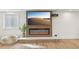 Bright living room featuring a modern fireplace and sleek design at 1355 Lockwood Sw Dr, Atlanta, GA 30311
