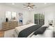 Stylishly furnished bedroom with hardwood floors and a view of the trees from the balcony at 1355 Lockwood Sw Dr, Atlanta, GA 30311