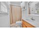 A clean, bright bathroom with a shower and tub combination and vanity at 20 Juniper Se Ln, Cartersville, GA 30121