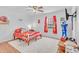 bedroom with bright Chiefs decor, wood floors, and a large window at 20 Juniper Se Ln, Cartersville, GA 30121