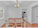 Bright dining room with hardwood floors, a chandelier, and a window view at 20 Juniper Se Ln, Cartersville, GA 30121