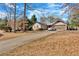 Charming single-story home featuring a long driveway and an attached two-car garage at 20 Juniper Se Ln, Cartersville, GA 30121