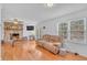 Bright and airy living room featuring a stone fireplace and hardwood floors at 20 Juniper Se Ln, Cartersville, GA 30121