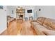 Bright living room with hardwood floors, stone fireplace, ceiling fan, and comfortable couches at 20 Juniper Se Ln, Cartersville, GA 30121