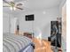 Bedroom featuring hardwood floors, a ceiling fan, and a mounted television at 20 Juniper Se Ln, Cartersville, GA 30121