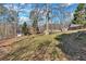 Sloping backyard with a versatile layout and natural surroundings, offering endless possibilities for outdoor activities at 20 Juniper Se Ln, Cartersville, GA 30121